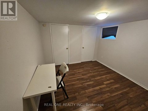 A room with a desk and chair in it.