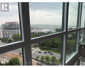 A view from a window looking out at a cityscape.