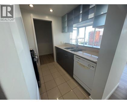 A kitchen with a dishwasher and a sink.