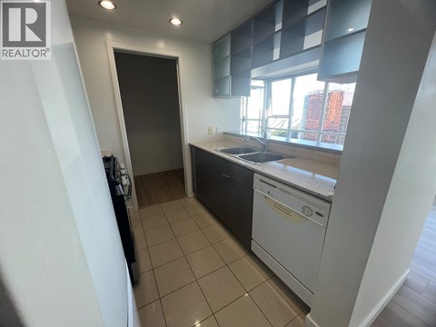 A kitchen with a dishwasher and a sink.