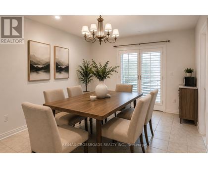A dining room with a wooden table and chairs.