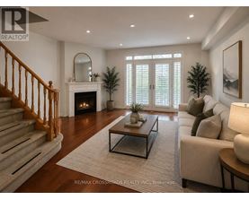 A living room with a fireplace and a couch.