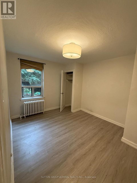 A room with a window and a radiator.