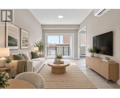 A well-lit, modern living room with a large window and a flat-screen TV.