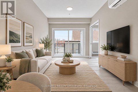A well-lit, modern living room with a large window and a flat-screen TV.