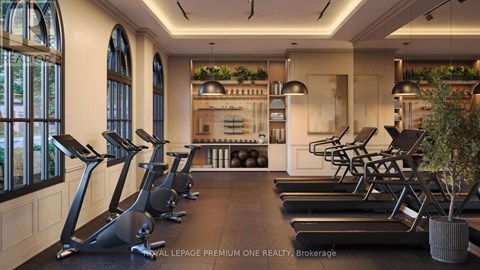 A gym with treadmills and a row of exercise bikes.