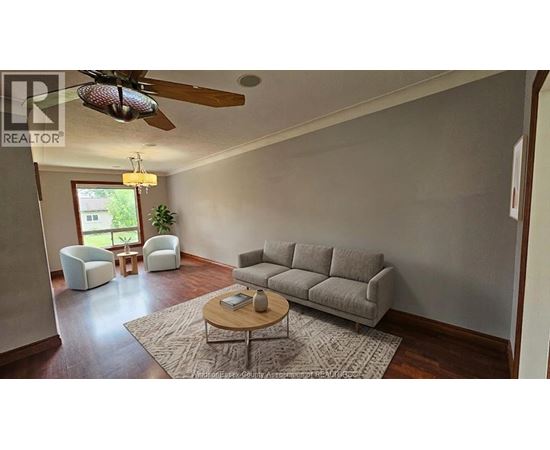 A living room with a grey couch and a coffee table.
