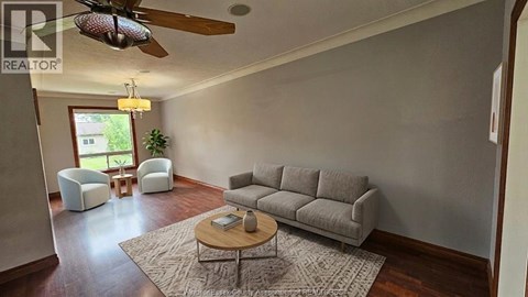 A living room with a grey couch and a coffee table.