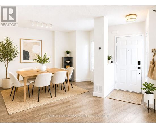 A dining room with a table set for four.