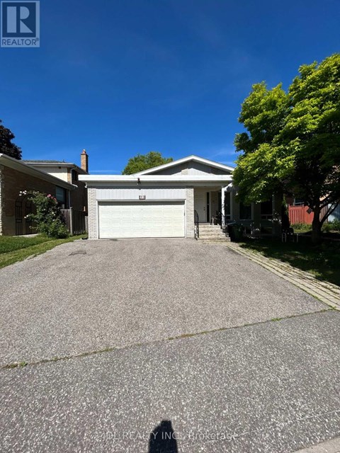 A house with a white garage door is for sale.