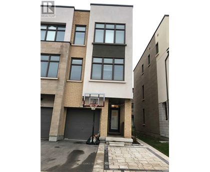 A basketball hoop is attached to the side of a building.