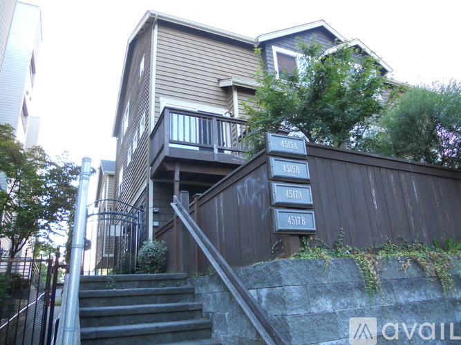 A brown house with the numbers 4515A, 4515B, and 4515C on the front.