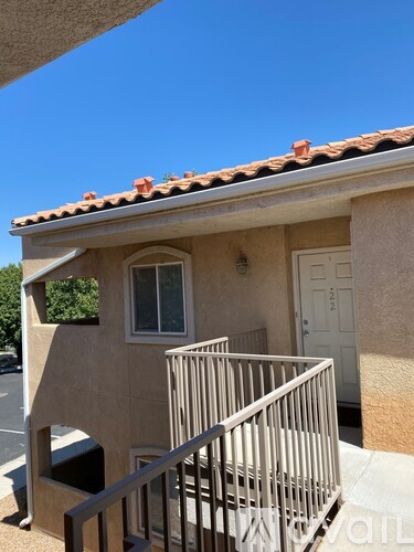 A house with a red tile roof and a white door.