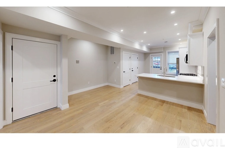A white door is on the left side of the image.