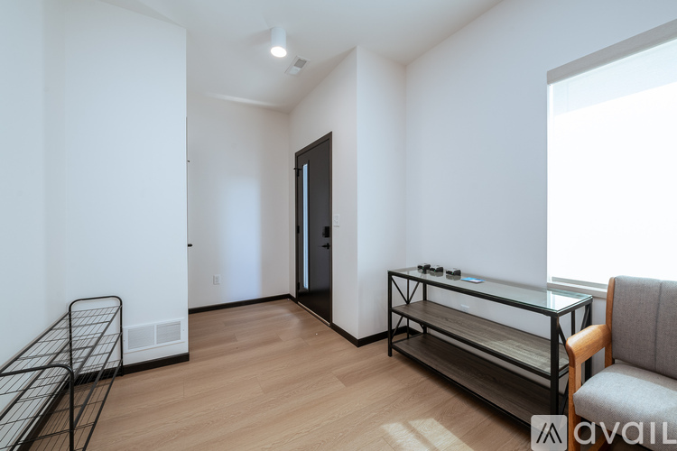 A two-car garage with a white exterior and a black roof is available for rent.