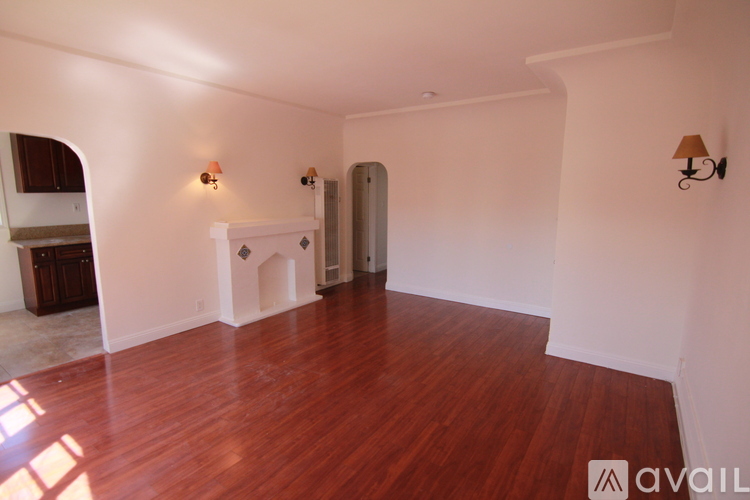 A room with wooden floors and white walls.