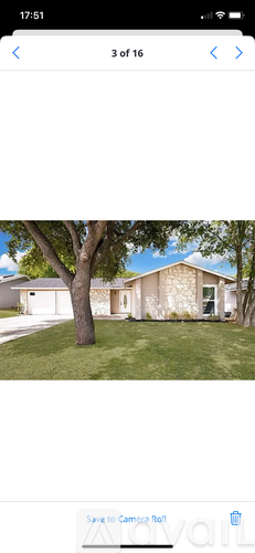 A house with a tree in front of it.