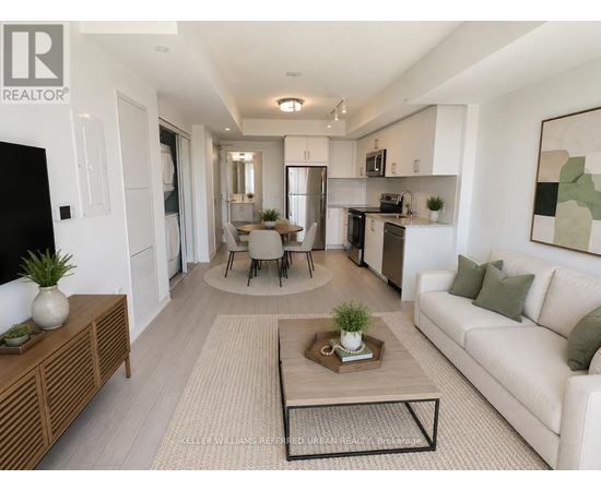 A modern living room with a white couch, a coffee table, and a dining table with chairs.