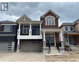 A house with a realtor logo on the top left corner.