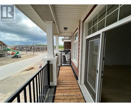 A balcony of a house under construction with a REALTOR sign.