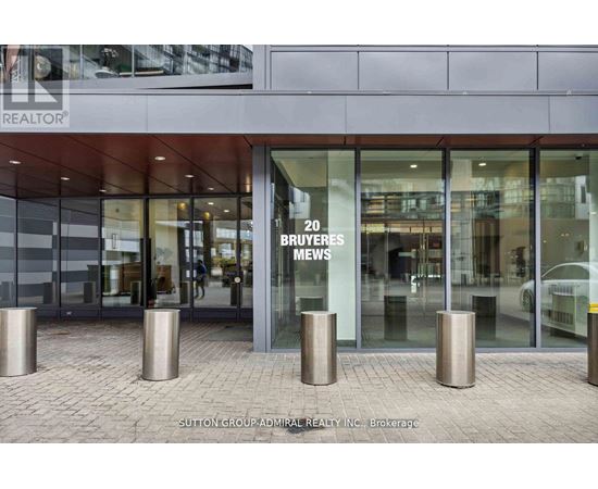 A building with a glass entrance and a sign that says "20 BUYERS NEWS".