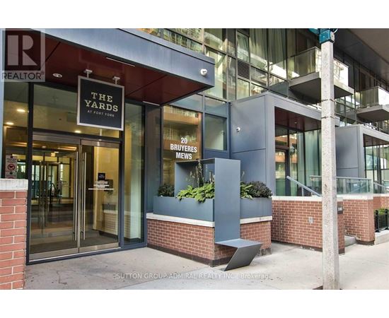 The front of a building with a glass door and a sign that says "The Yards".