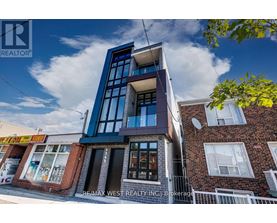 A modern building with a blue and white facade is the focus of this image.
