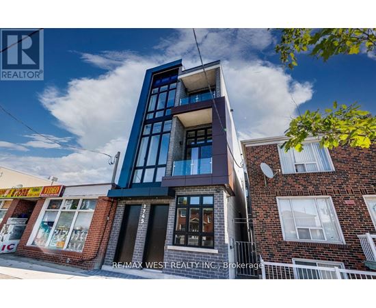 A modern building with a blue and white facade is the focus of this image.