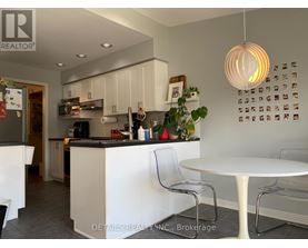 A modern kitchen with white cabinets and a large island.