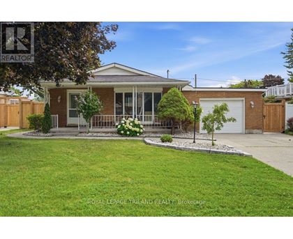 A house with a lawn in front of it.