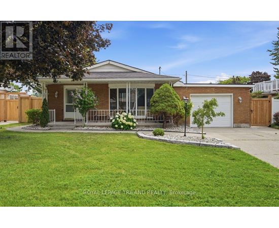 A house with a lawn in front of it.