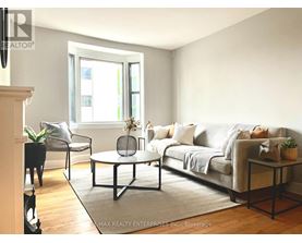 A white dryer and washer are in a small room.