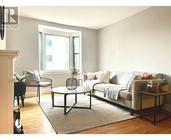 A white dryer and washer are in a small room.