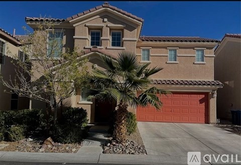 A house with a red garage door is for sale.