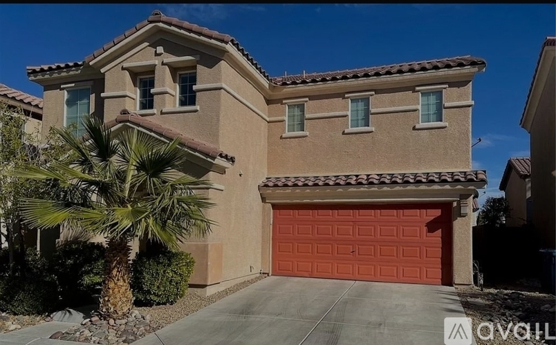 A house with a red garage door is for sale.