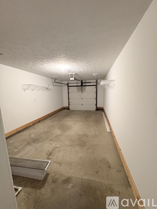 A room with white walls and a concrete floor.