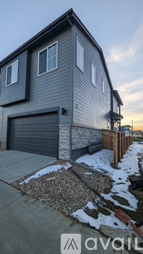A house with a garage is for sale.