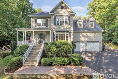 A house with a front porch and a garage.