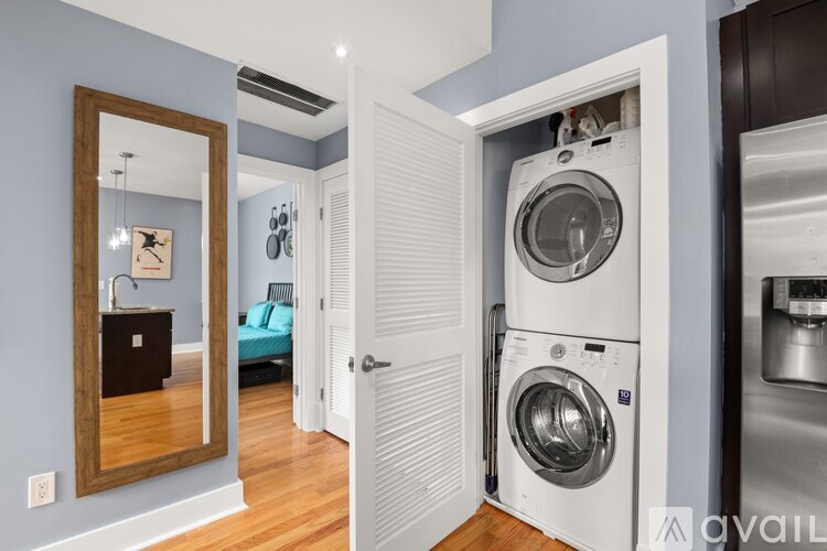 A laundry room with a washer and dryer in it.