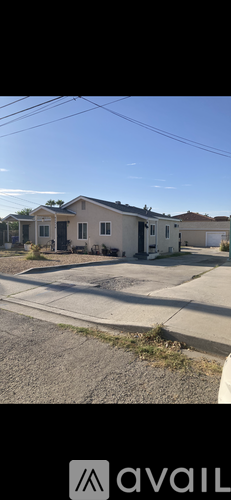 A row of houses with a sign that says "available" in the foreground.