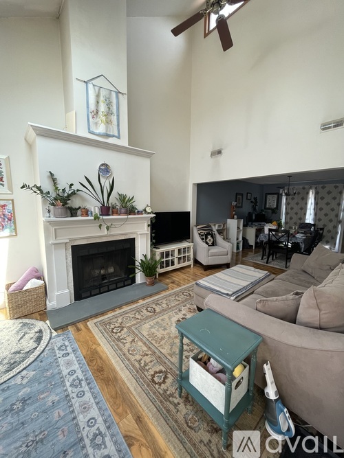 A living room with a fireplace and a couch.