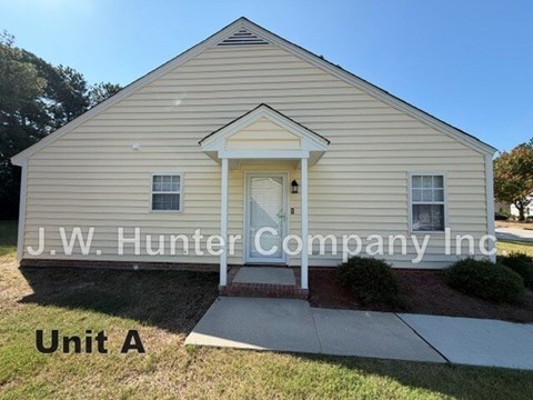 A small building with the words J.W. Hunter Company Inc written on it.