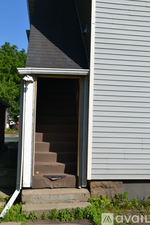 A set of stairs leads up to a doorway.
