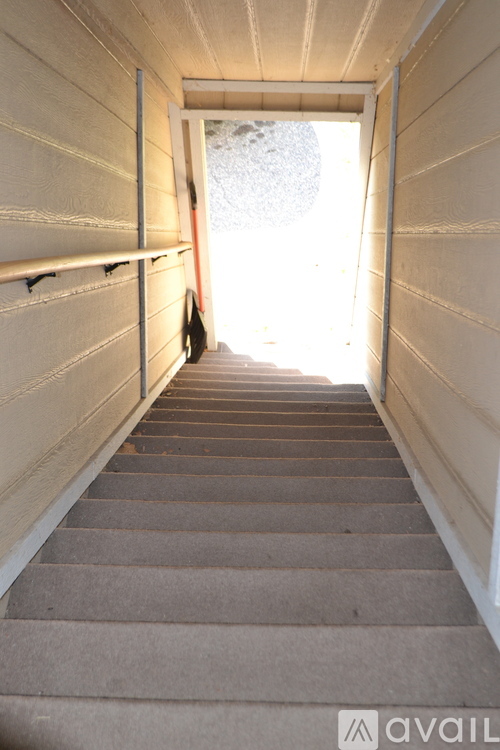 A staircase leading to a bright light at the end.