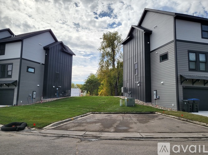 A modern two-story house with a garage is available for rent.