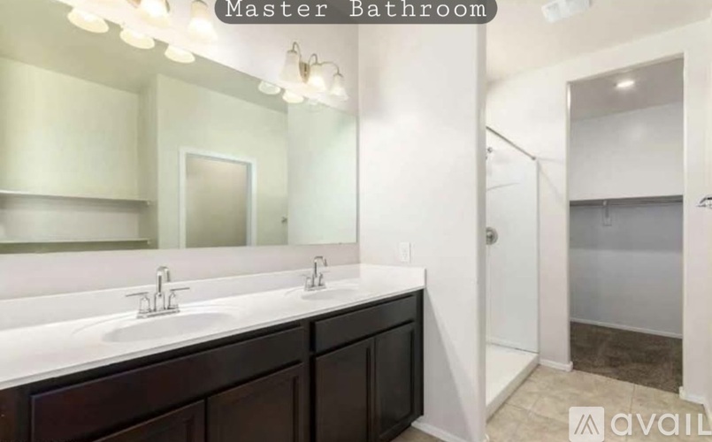 A master bathroom with a double sink vanity.