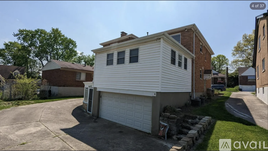 A house with a garage is available for sale.