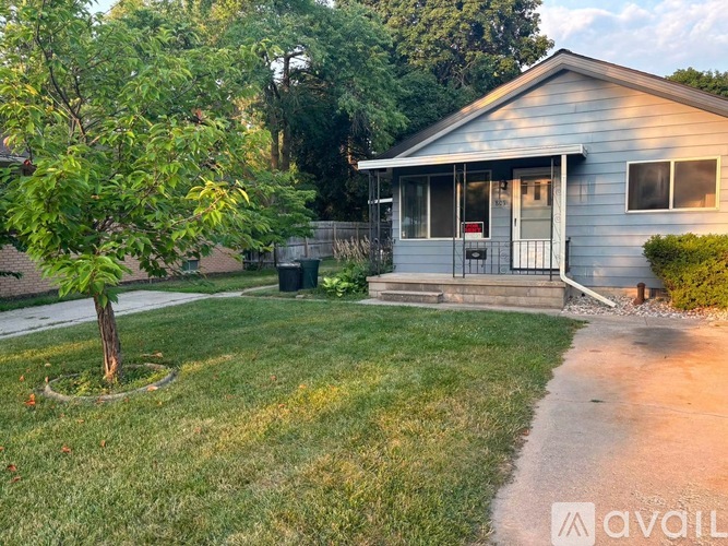 A house with a tree in front of it.