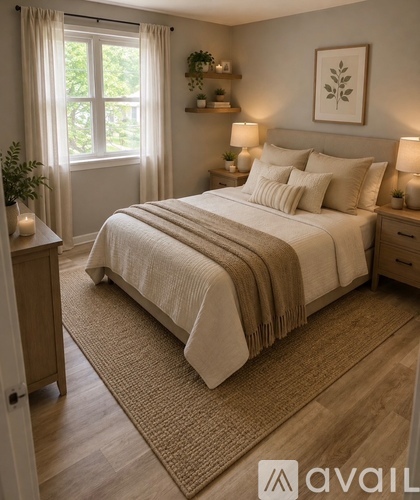 A bedroom with a large bed, a window with curtains, and a rug on the floor.