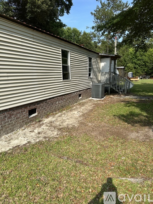 A house with a metal roof and a small porch.